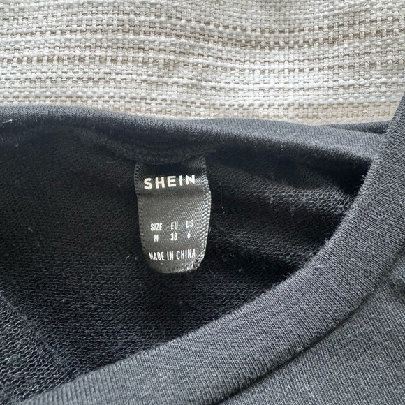 Black Sleeveless Dress with Ruched Sides and Shoulder Pads - Picture 6 of 7